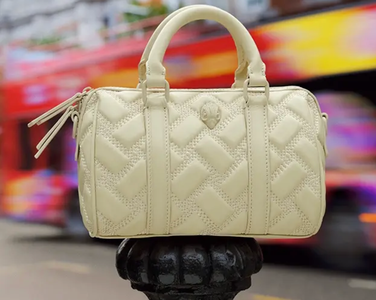 cream quilted barrel bag padded mini handbag