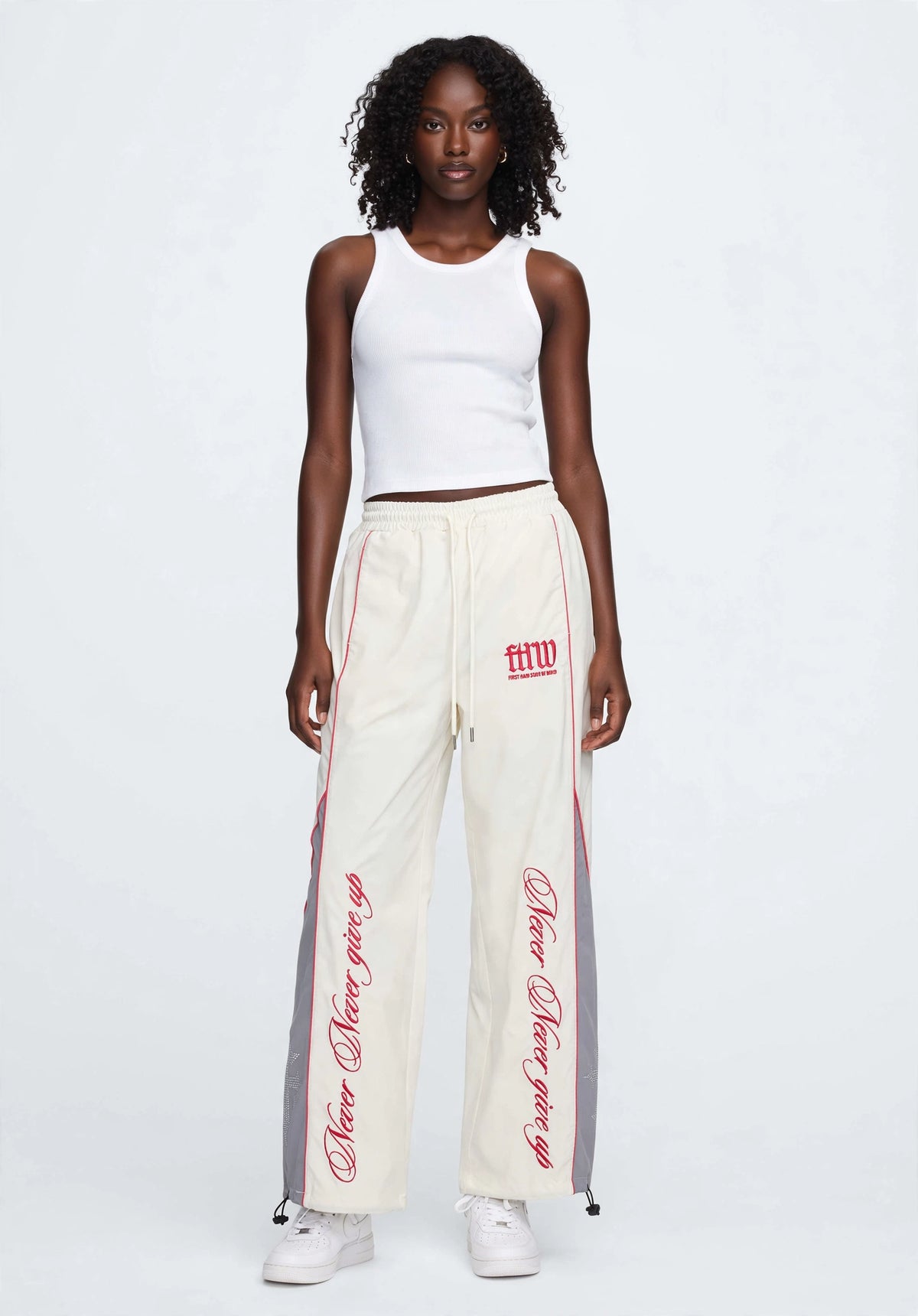 PROPERTY OF FIRST ROW TRACK PANTS